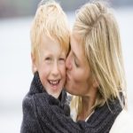 woman kissing son